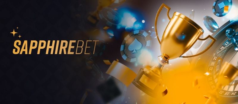 Banner promocional do SapphireBet Casino com troféu dourado, fichas de casino e efeitos de luz bokeh
